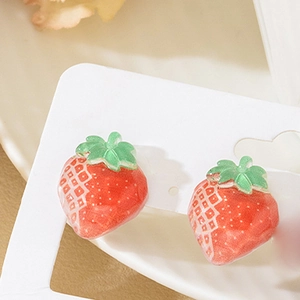 Cute red strawberry acrylic earrings with green leaf details on display card