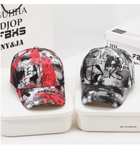 Close-up of graffiti print detail on cotton twill street style baseball caps in set