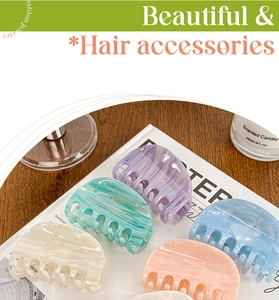 Detailed set of marble pattern acetate hair claws in pastel purple and blue colors