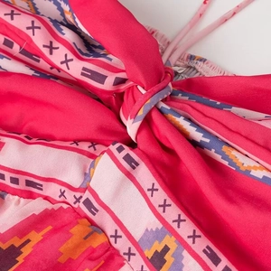 Ethnic geometric print halter dress in pink with drawstring neck detail for beach vacation