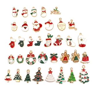 Colorful enamel Christmas charms set featuring Santa, trees, and wreaths on gold metal