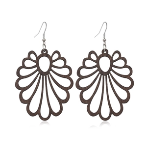 Detailed close-up of dark brown hollowed-out wooden petal earrings on a white background