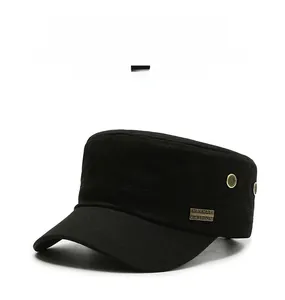 Detail of black cotton military cap featuring metal eyelets and a decorative side plaque