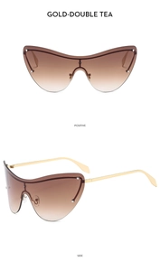 Detail view of gold metal rimless cat-eye sunglasses with gradient double tea lenses