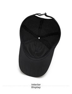Interior view of black mesh baseball cap showing breathable holes and adjustable strap