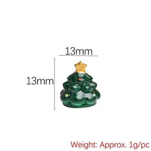 Close-up of a 13mm miniature resin Christmas tree with colorful dots and a gold star