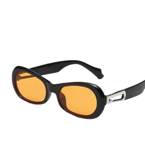 Retro oval black sunglasses with orange lenses and silver metal hollowed-out temple detail