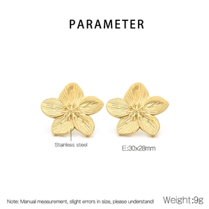 Detail of 18K gold stainless steel flower earrings showing brushed metal texture and size