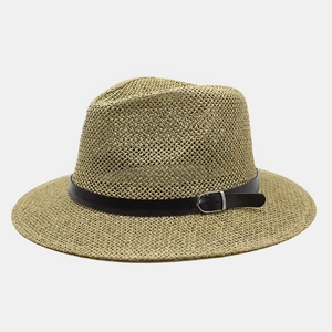 Detailed straw weave texture and black leather band with silver buckle on the hat