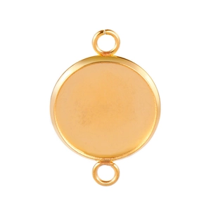 Macro detail of a golden round stainless steel jewelry bezel tray with side loops