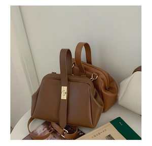 Detail of vintage doctor style handbags with metal clasp and premium leather texture