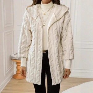 Detailed texture of cable knit and soft faux fur on a cozy cream hooded cardigan