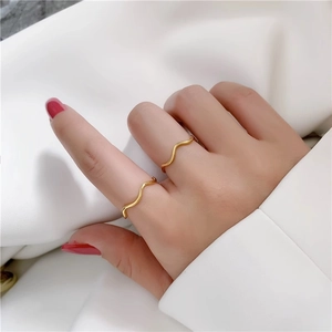 Minimalist geometric wave gold rings in stainless steel for a stylish stacked look