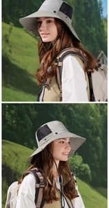 Detail of outdoor sun hat featuring wide brim and black breathable mesh panels