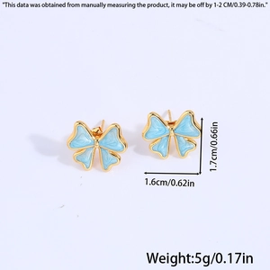 Detail view of blue butterfly enamel stud earrings with 1.6cm by 1.7cm dimensions
