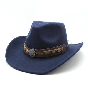 Detail of dark blue wool fedora with brown strap featuring metal stars and floral rivets