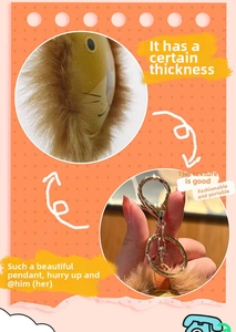 Detail of plush lion keychain showing the thick filling and golden lobster clasp