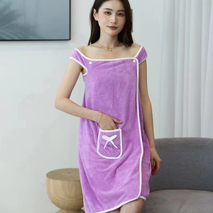 Purple coral fleece wearable bath wrap with white scalloped trim and bow pocket detail