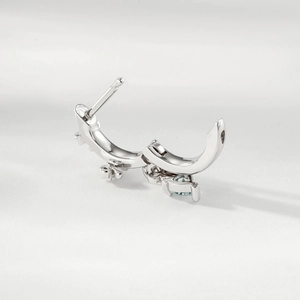 Elegant silver huggie hoop earring with bow pendant and sparkling crystals for women