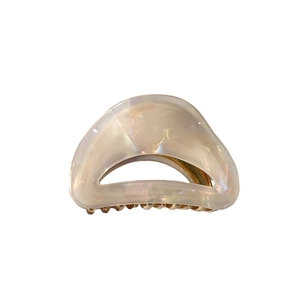 Cream leopard acetate hair claw clip with mother-of-pearl finish and gold metal spring