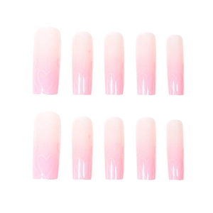 Pink gradient long press-on nails with heart and sparkle patterns in a 10-piece set