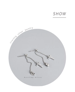 Detailed close-up of 925 sterling silver cross chain stud earrings with S925 hallmark