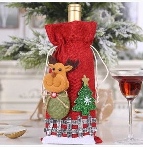 Detail of burlap Christmas wine bottle cover featuring 3D reindeer and tree appliques
