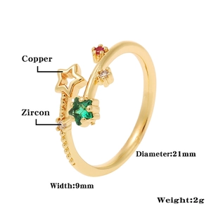 Detail of copper star ring with green and red zircon stones and size specifications