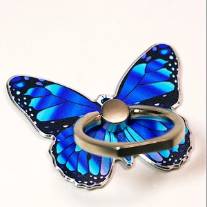 Detail of blue butterfly phone ring holder with metallic finish and intricate wing patterns