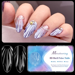 Macro detail of almond 3D shell texture press-on nails with pearls and starfish charms