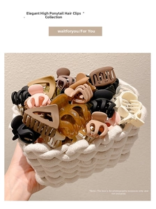 Variety of claw clips in Morandi colors displayed in a white woven basket backdrop