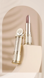 Detailed macro view of dual-color eyeshadow stick with golden Peking Opera relief case