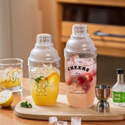 Detailed view of cocktail shakers with cartoon prints in a cozy home setting