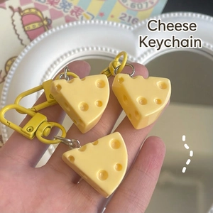 Three cute yellow cheese-shaped keychains with matte finish and matching metal lobster clips
