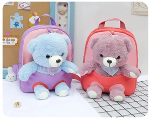 Detail of cute teddy bear plush backpacks for kids with polka dot scarves and soft nylon fabric