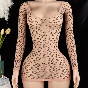 Detailed view of long sleeve leopard print bodycon dress on a mannequin with props