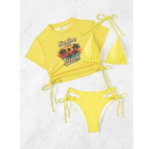 Close-up of three-piece yellow mesh bikini with Explore the Beach graphic print