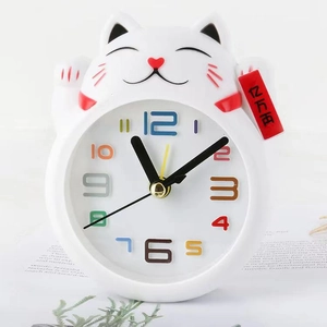 Creative white Maneki Neko lucky cat alarm clock with colorful numerals and decorative tag