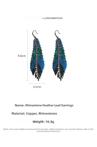 Detailed macro view of rhinestone feather earrings showing copper and crystal material texture