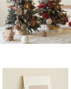 Mini PE Christmas trees with warm LED lights, wooden house charms, and festive red ribbons