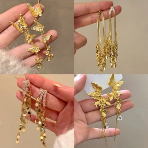 Elegant gold tassel earrings with butterfly and leaf charms in a four-style collage set