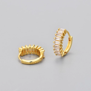 Close-up of S925 silver hoop earrings with rectangular zircon and golden finish