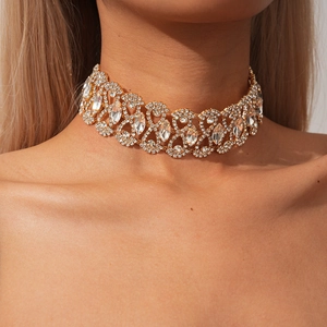 Close-up of a vintage palace style gold geometric choker with sparkling rhinestones