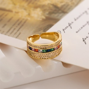 Macro detail of gold-plated MAMA ring featuring multi-colored micro-pave cubic zirconia