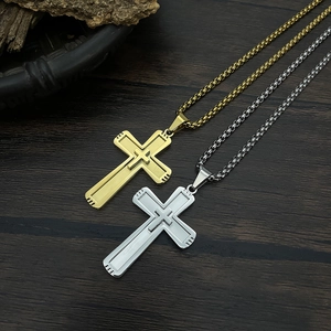 Classic gold and silver stainless steel cross necklaces with box chains on wood surface