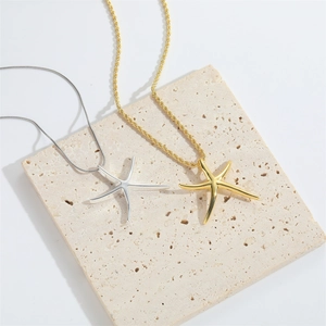Minimalist starfish pendant necklace set in polished gold and silver finishes