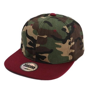 Flat brim baseball cap featuring a camouflage crown and dark red visor in street style