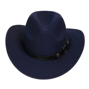 Detail view of navy blue felt cowboy hat with black leather strap and gold metal rivets