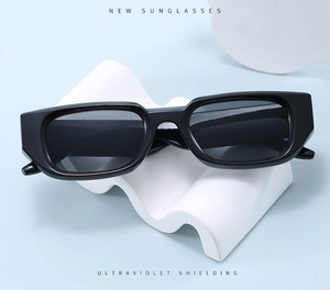 Detail view of rectangular sunglasses on wave props featuring UV protection feature