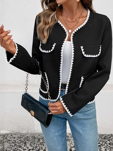 French style black knit cardigan featuring white scalloped lace trim and waffle texture